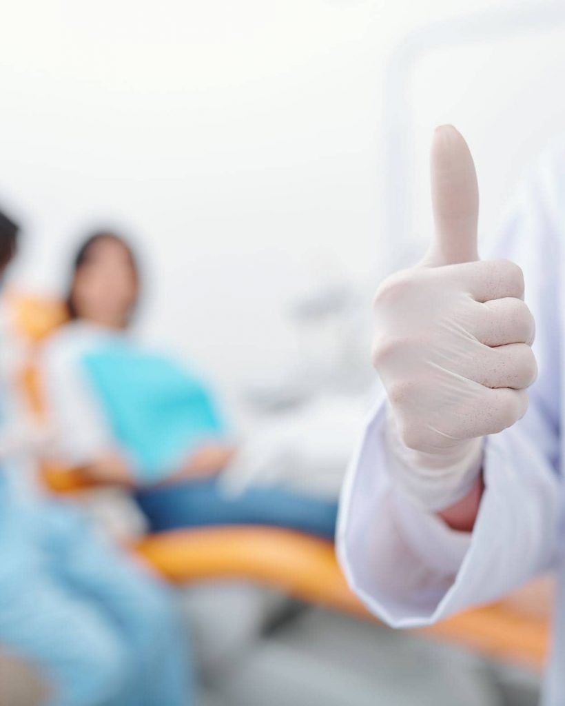 dentist-showing-thumbs-up-2021-08-30-04-03-05-utc-2